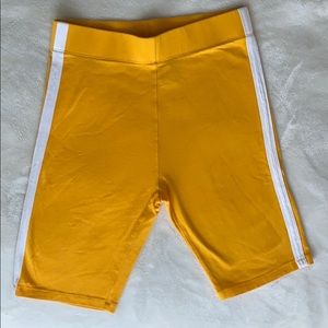 yellow biker shorts with white stripe on the side